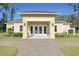 Exterior shot of the clubhouse with brick and yellow siding at 1878 Heritage Loop, Myrtle Beach, SC 29577