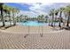 A large community pool surrounded by palm trees and chairs at 1878 Heritage Loop, Myrtle Beach, SC 29577