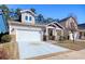 View of the home's front exterior, showcasing its driveway and partial lawn at 1878 Heritage Loop, Myrtle Beach, SC 29577
