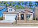 Charming single-Gathering home with stone accents, front porch, and two-car garage at 1878 Heritage Loop, Myrtle Beach, SC 29577