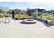 A community fire pit area with seating in Emmens Preserve at 1878 Heritage Loop, Myrtle Beach, SC 29577