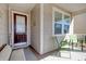 Inviting front porch with seating area and decorative front door at 1878 Heritage Loop, Myrtle Beach, SC 29577