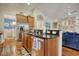 Kitchen with stainless steel appliances, wood cabinets and granite countertops with a view to the dining room at 1878 Heritage Loop, Myrtle Beach, SC 29577