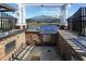 An outdoor brick kitchen area with grill and metal countertop at 1878 Heritage Loop, Myrtle Beach, SC 29577