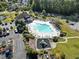 Aerial view of neighborhood pool, playground, parking lot, and landscaping at 200 Vendura Ct. # B, Murrells Inlet, SC 29576