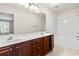 Bathroom featuring a double sink vanity and bathtub with shower at 200 Vendura Ct. # B, Murrells Inlet, SC 29576