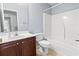 Full bathroom with a single sink vanity, commode, and tub shower with blue walls at 200 Vendura Ct. # B, Murrells Inlet, SC 29576