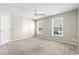 Bright bedroom with plush carpet, two windows, a ceiling fan and a closet at 200 Vendura Ct. # B, Murrells Inlet, SC 29576