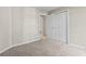 Bright bedroom featuring neutral walls, carpet floors, and a closet with white doors at 200 Vendura Ct. # B, Murrells Inlet, SC 29576