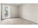 Neutral bedroom featuring a large glass door with backyard view and plush carpet at 200 Vendura Ct. # B, Murrells Inlet, SC 29576