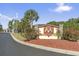 Entrance sign for International Club with palm trees and colorful flowers at 200 Vendura Ct. # B, Murrells Inlet, SC 29576
