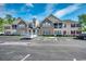 Attractive multi-Gathering residential building with brick accents, balconies, and ample parking under a blue sky at 200 Vendura Ct. # B, Murrells Inlet, SC 29576