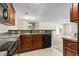 Kitchen with dark cabinetry, black appliances and an open view to the living area at 200 Vendura Ct. # B, Murrells Inlet, SC 29576