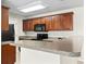 Kitchen featuring dark wood cabinets and ample counter space, creating a functional cooking area with modern appliances at 200 Vendura Ct. # B, Murrells Inlet, SC 29576