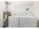 Well-equipped laundry area with a modern washer, dryer, and hot water heater at 200 Vendura Ct. # B, Murrells Inlet, SC 29576