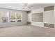 Well-lit living room showcasing neutral carpet, large windows, and stylish wall accents for a relaxing space at 200 Vendura Ct. # B, Murrells Inlet, SC 29576