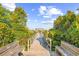 Picturesque boardwalk leading to the beach, bordered by lush greenery at 202 Spreading Oak Dr., Pawleys Island, SC 29585