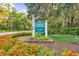 Entrance to Litchfield Plantation, showcasing lush landscaping, the community sign, and beautiful trees at 202 Spreading Oak Dr., Pawleys Island, SC 29585
