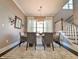 Dining room with large window, stylish chandelier, and seating for six at 202 Spreading Oak Dr., Pawleys Island, SC 29585