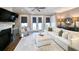 Bright living room features fireplace, comfortable seating, and access to outdoor space at 202 Spreading Oak Dr., Pawleys Island, SC 29585