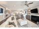 Spacious living room open to the kitchen featuring fireplace and a neutral color palette at 202 Spreading Oak Dr., Pawleys Island, SC 29585