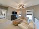 Upstairs living room with comfortable seating and media center, ceiling fan and bright windows at 202 Spreading Oak Dr., Pawleys Island, SC 29585