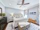 Spacious main bedroom with plush bedding, ceiling fan, and neutral color palette at 202 Spreading Oak Dr., Pawleys Island, SC 29585