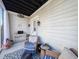 Cozy screened porch features comfortable seating and relaxing ambiance at 202 Spreading Oak Dr., Pawleys Island, SC 29585