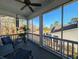 Relaxing screened porch with comfortable seating, a ceiling fan, and a view of the outdoor scenery at 202 Spreading Oak Dr., Pawleys Island, SC 29585