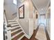 Staircase with hardwood treads and white risers leading to upper level at 202 Spreading Oak Dr., Pawleys Island, SC 29585