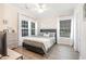 Well-lit bedroom with wood floors, modern decor, and large windows with lots of natural light at 2033 Silvercrest Dr. # 21 B, Myrtle Beach, SC 29579