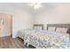 Bedroom includes two twin beds with matching bedding, wood floors, and a ceiling fan at 2033 Silvercrest Dr. # 21 B, Myrtle Beach, SC 29579