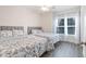 Bedroom includes two twin beds with matching bedding, wood floors, and windows at 2033 Silvercrest Dr. # 21 B, Myrtle Beach, SC 29579