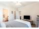 This bedroom includes an ensuite bathroom, laminate floors, and modern furnishings at 2033 Silvercrest Dr. # 21 B, Myrtle Beach, SC 29579