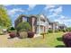 Exterior of the building showcasing balconies, brick facade, landscaping, and well-kept lawns at 2033 Silvercrest Dr. # 21 B, Myrtle Beach, SC 29579