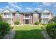 Exterior of the building with well-manicured lawn and landscaping at 2033 Silvercrest Dr. # 21 B, Myrtle Beach, SC 29579