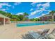 Community pool with lounge chairs, palm trees, and plenty of space to relax at 2033 Silvercrest Dr. # 21 B, Myrtle Beach, SC 29579