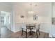 Cozy dining area with table and seating and a stylish chandelier for Gathering dinners at 2033 Silvercrest Dr. # 21 B, Myrtle Beach, SC 29579