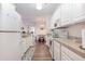 Bright kitchen featuring white cabinetry, modern appliances, and an open layout leading to the dining area at 2033 Silvercrest Dr. # 21 B, Myrtle Beach, SC 29579