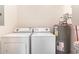 Utility room featuring side by side washer and dryer with a hot water heater at 2033 Silvercrest Dr. # 21 B, Myrtle Beach, SC 29579