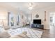 Beautiful living room features a comfortable couch, ceiling fan, and sliding glass doors to the balcony at 2033 Silvercrest Dr. # 21 B, Myrtle Beach, SC 29579