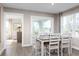 Eat-in kitchen and dining area with a door to the lanai at 2053 Nw Parow Ln Nw # B, Calabash, NC 28467
