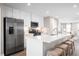 Modern kitchen with stainless steel appliances, white cabinets, and an island with seating at 2053 Nw Parow Ln Nw # B, Calabash, NC 28467