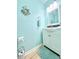 Bright bathroom featuring a white vanity with beach-themed decor at 210 Double Eagle Dr. # G1, Myrtle Beach, SC 29575