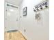 Entryway with wood flooring and a welcome sign hanging on the wall at 210 Double Eagle Dr. # G1, Myrtle Beach, SC 29575