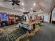 Fun game room with air hockey tables and various arcade machines for recreation at 210 Double Eagle Dr. # G1, Myrtle Beach, SC 29575