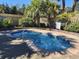 Cozy in-ground hot tub surrounded by lush landscaping and privacy fencing at 210 Double Eagle Dr. # G1, Myrtle Beach, SC 29575
