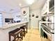 Inviting kitchen with granite counters and stools with a view of the living area at 210 Double Eagle Dr. # G1, Myrtle Beach, SC 29575