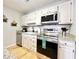 Well-equipped kitchen features stainless steel appliances and white cabinetry at 210 Double Eagle Dr. # G1, Myrtle Beach, SC 29575