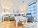 Comfortable living room featuring a soft sofa, stylish decor, and wood flooring at 210 Double Eagle Dr. # G1, Myrtle Beach, SC 29575